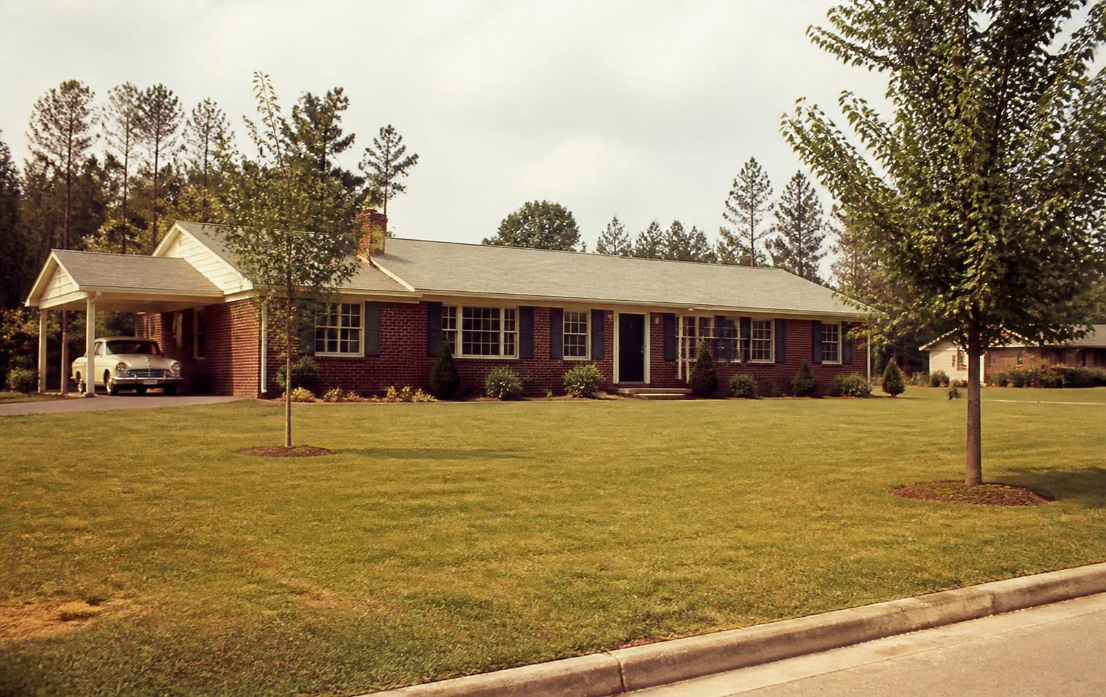 A 1950s brick ranch home in a newly developed Charlotte suburb