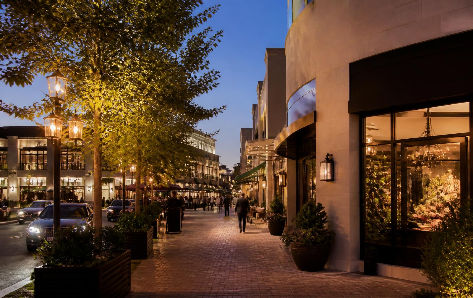 Open-air luxury shopping and dining district in SouthPark, Charlotte at dusk